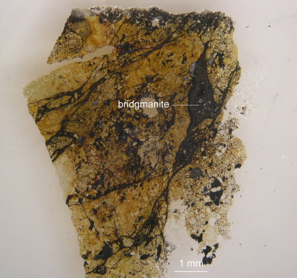 Figure 2: A fragment of the 4.5 billion year of Tenham meteorite containing shock veins of bridgmanite. Chi Ma via the American Geophysical Union , Accessed 7/7/14