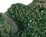 Uvarovite green crystals from Saranovskii Mine, Urals Region, Russia. Photo by Rob Lavinsky, iRocks.com