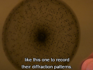 [celebrating crystallography displays a laser diffraction pattern]