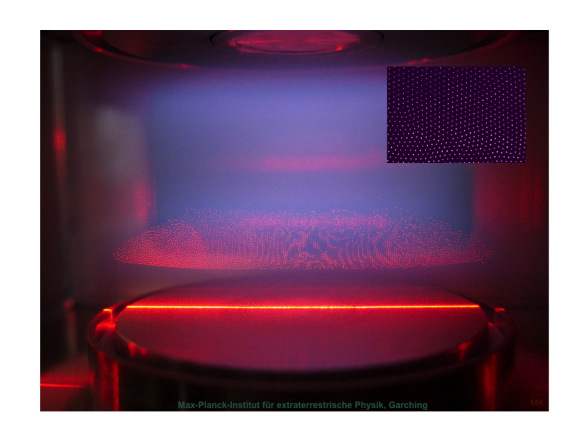 The image to the right shows the sideview of a plasma crystal in the laboratory. Dust particles are suspended in an argon plasma above a high-frequency electrode (bottom). The horizontal field of view is 2 cm. From the Max Plank Plasma Crystal Experiment http://www2011.mpe.mpg.de/pke/index_e.html